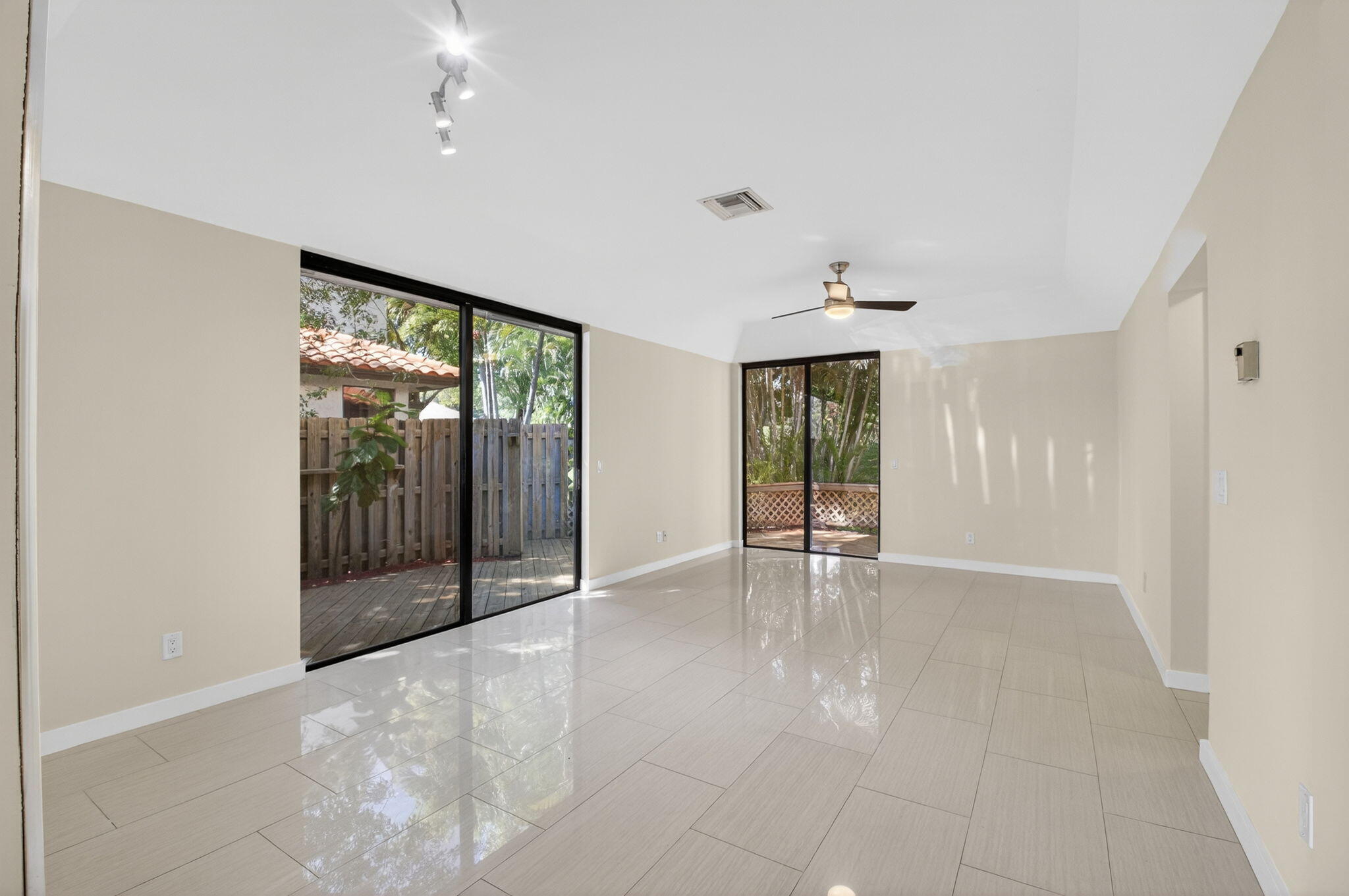 5845 Fox Hollow Drive, Unit A Boca Raton, FL 33486 - Photo 8 of 50 a view of an empty room with glass door and shower