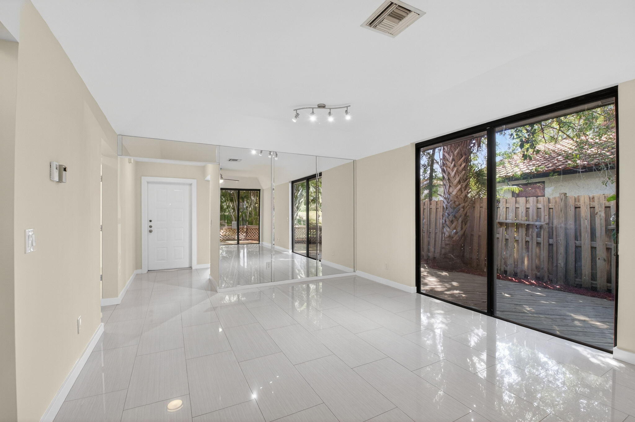5845 Fox Hollow Drive, Unit A Boca Raton, FL 33486 - Photo 9 of 50 a view of empty room with floor to ceiling window