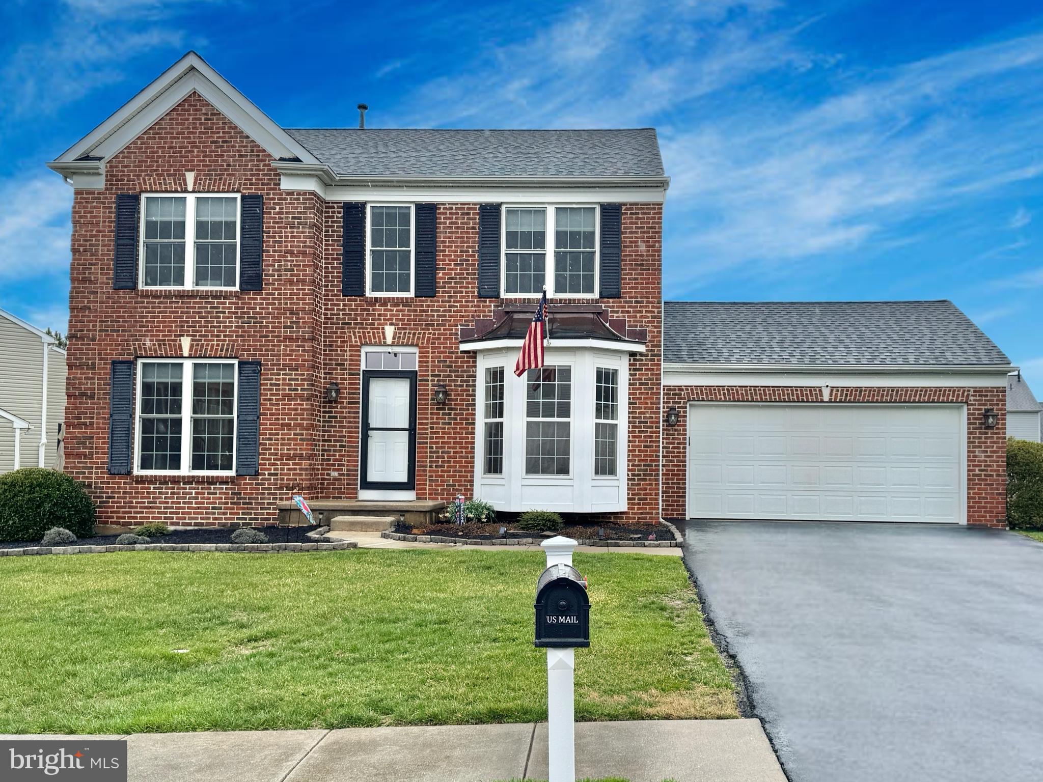 6 Osprey Lane Middletown, DE 19709 - Photo 1 of 8 a front view of a house with garden