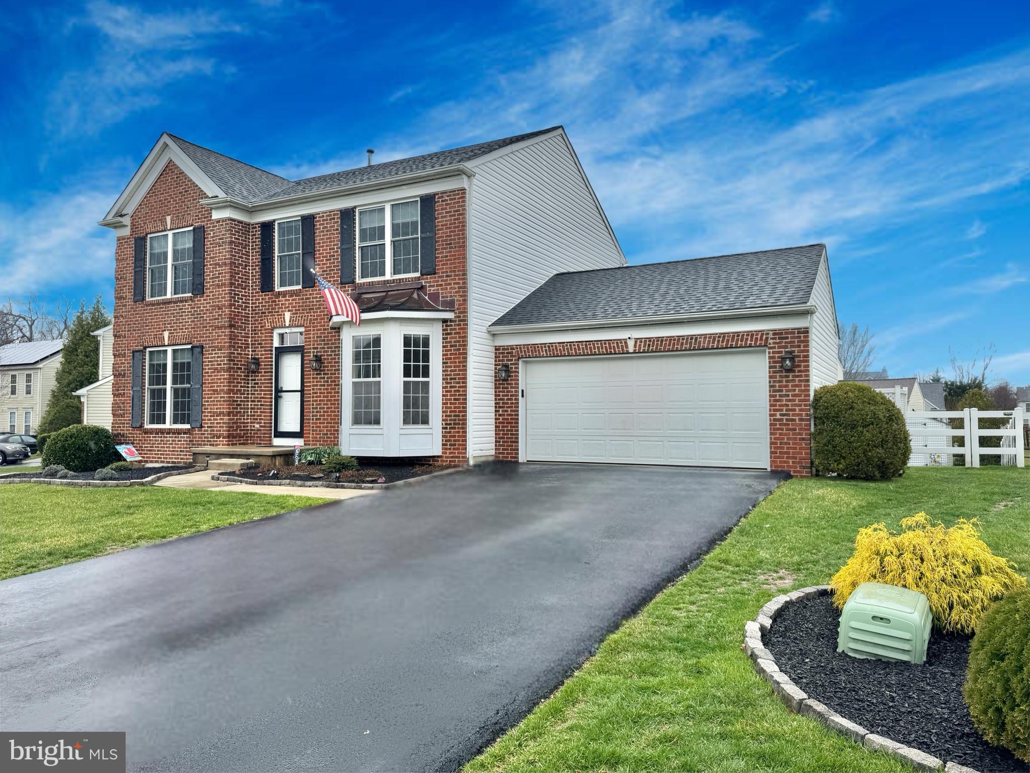 6 Osprey Lane Middletown, DE 19709 - Photo 2 of 8 a front view of a house with a yard and garage