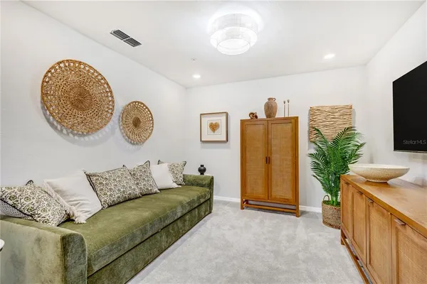 a living room with furniture and a table