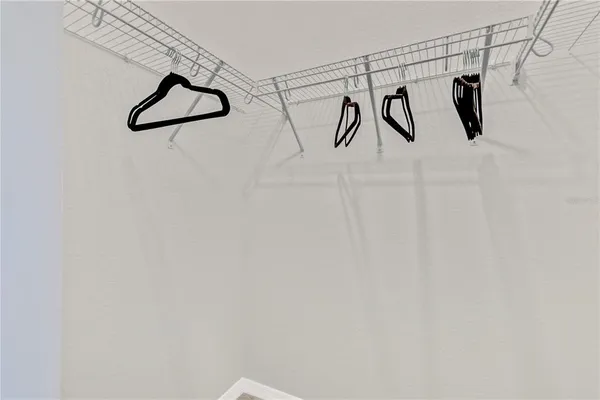 a bedroom with a bed and ceiling fan