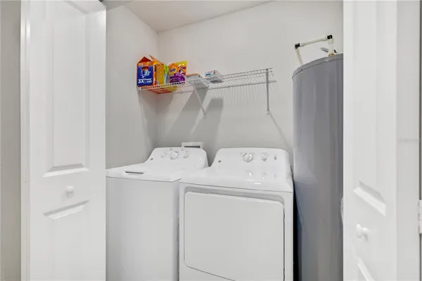 a view of a room with gym equipment and a large window