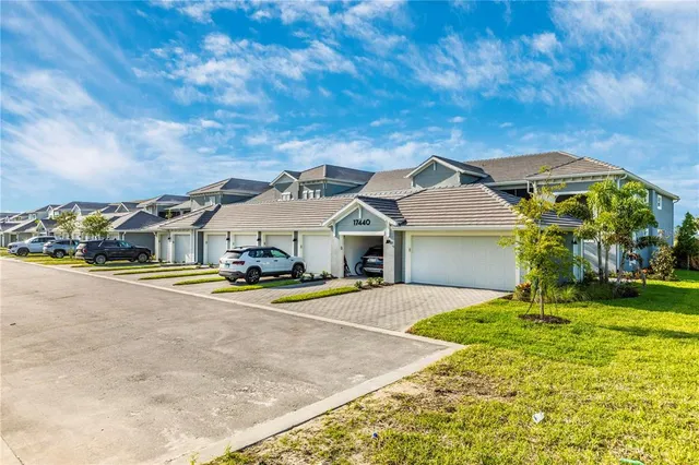 a view of a house with backyard porch and sitting area