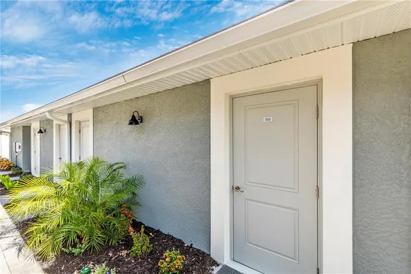 a view of a golf course with an ocean