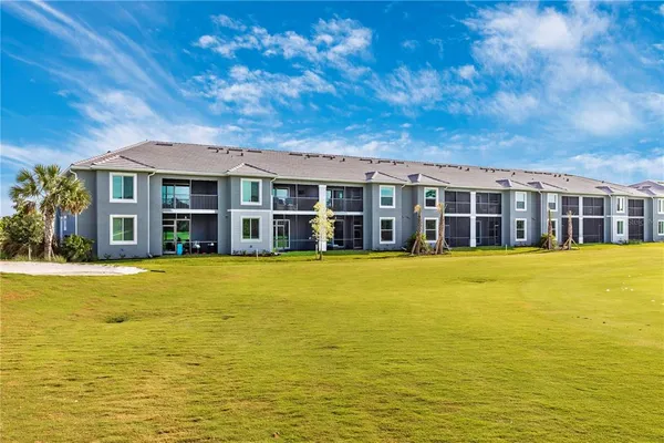 a view of a patio with a table and chairs