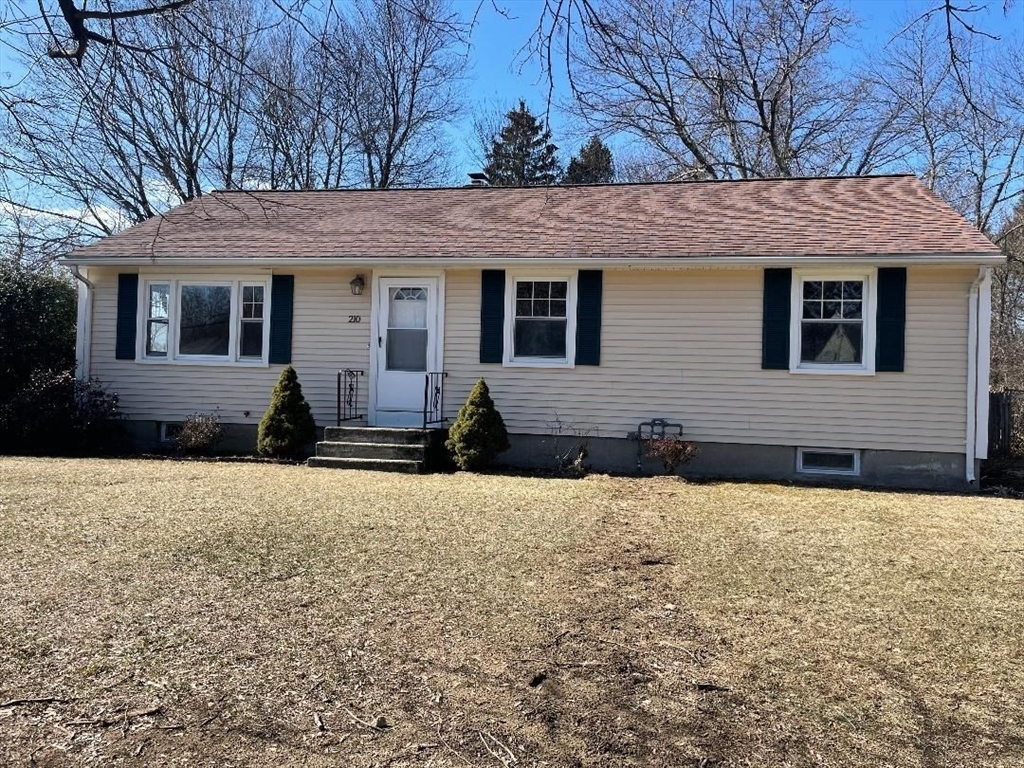 210 Navajo Road Springfield, MA 01109 - Photo 1 of 38 a front view of a house with a yard