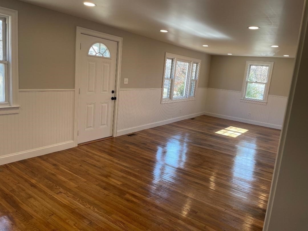 210 Navajo Road Springfield, MA 01109 - Photo 15 of 38 an empty room with wooden floor and windows