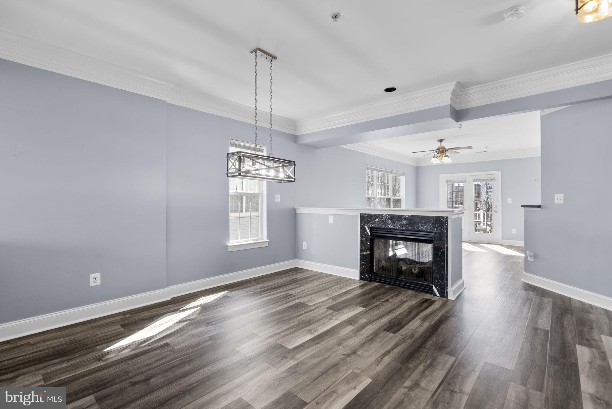 932 Orchard Ridge Drive, Unit 200 Gaithersburg, MD 20878 - Photo 11 of 51 a living room with furniture and fireplace