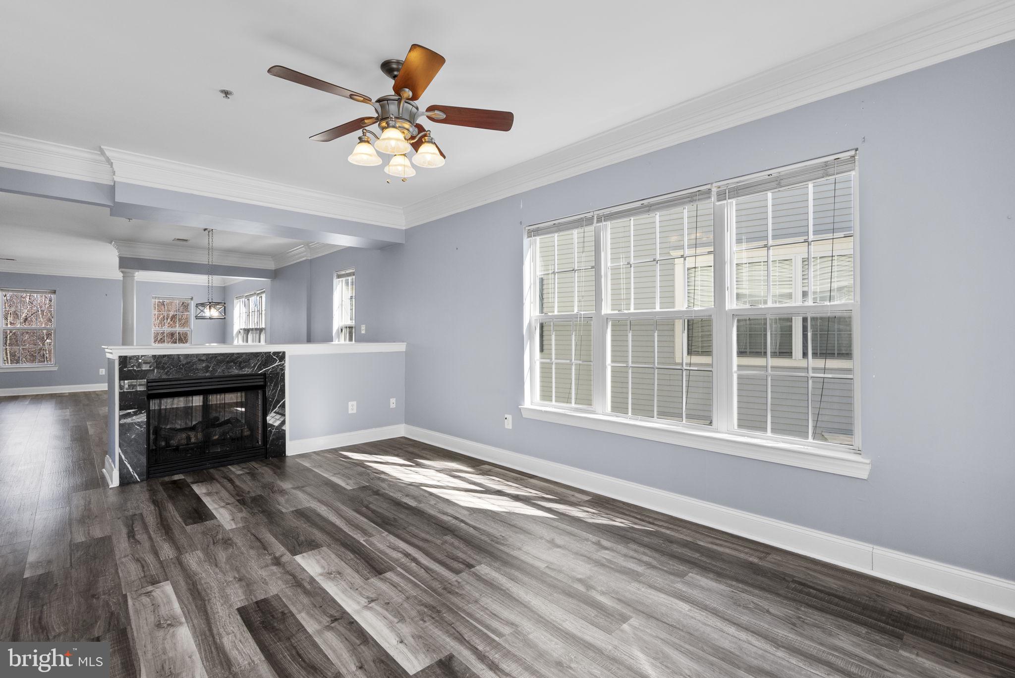 932 Orchard Ridge Drive, Unit 200 Gaithersburg, MD 20878 - Photo 19 of 51 a living room with furniture and a window