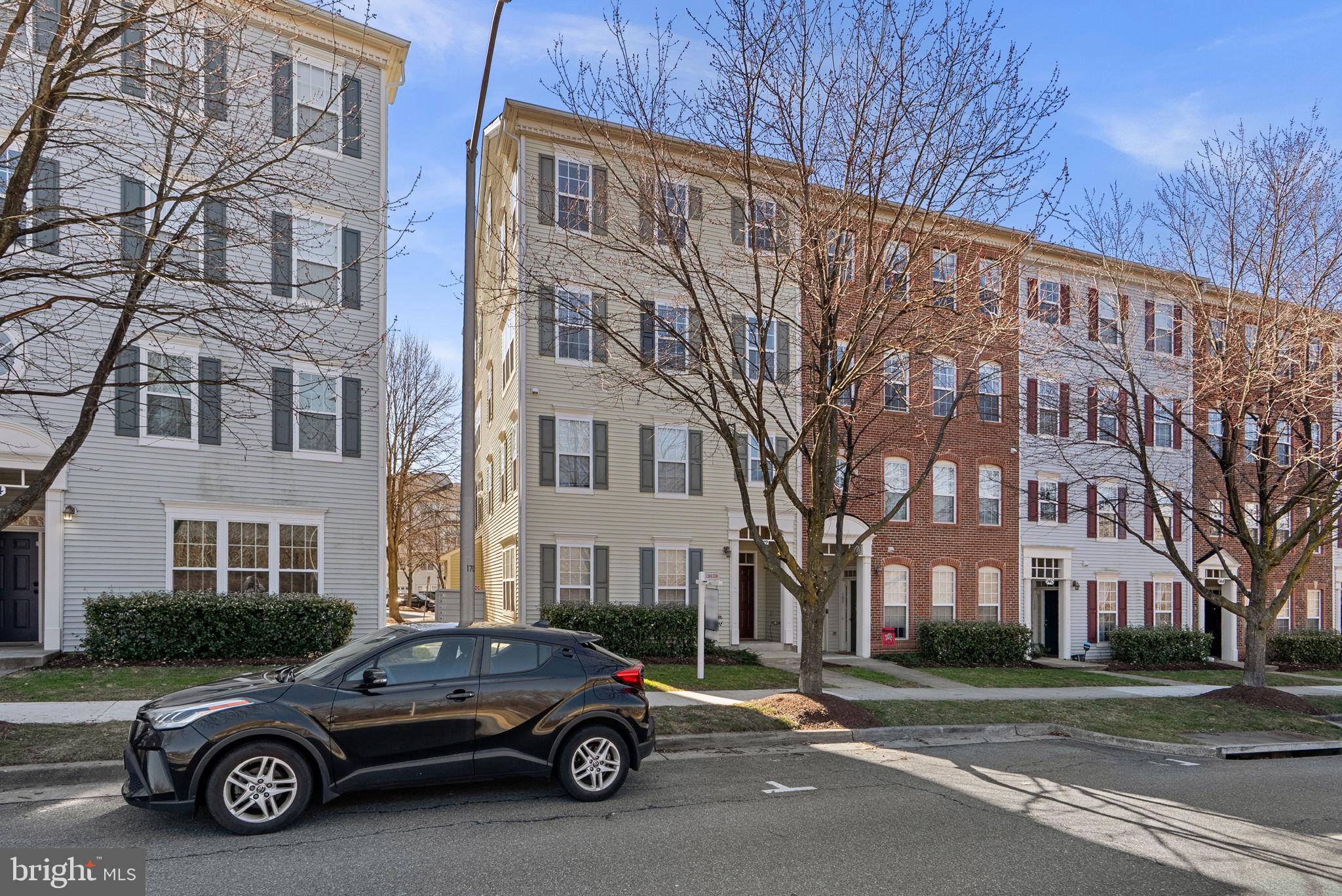 932 Orchard Ridge Drive, Unit 200 Gaithersburg, MD 20878 - Photo 2 of 51 a car parked in front of a brick building