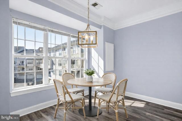 932 Orchard Ridge Drive, Unit 200 Gaithersburg, MD 20878 - Photo 20 of 51 a dining room with furniture large windows and wooden floor