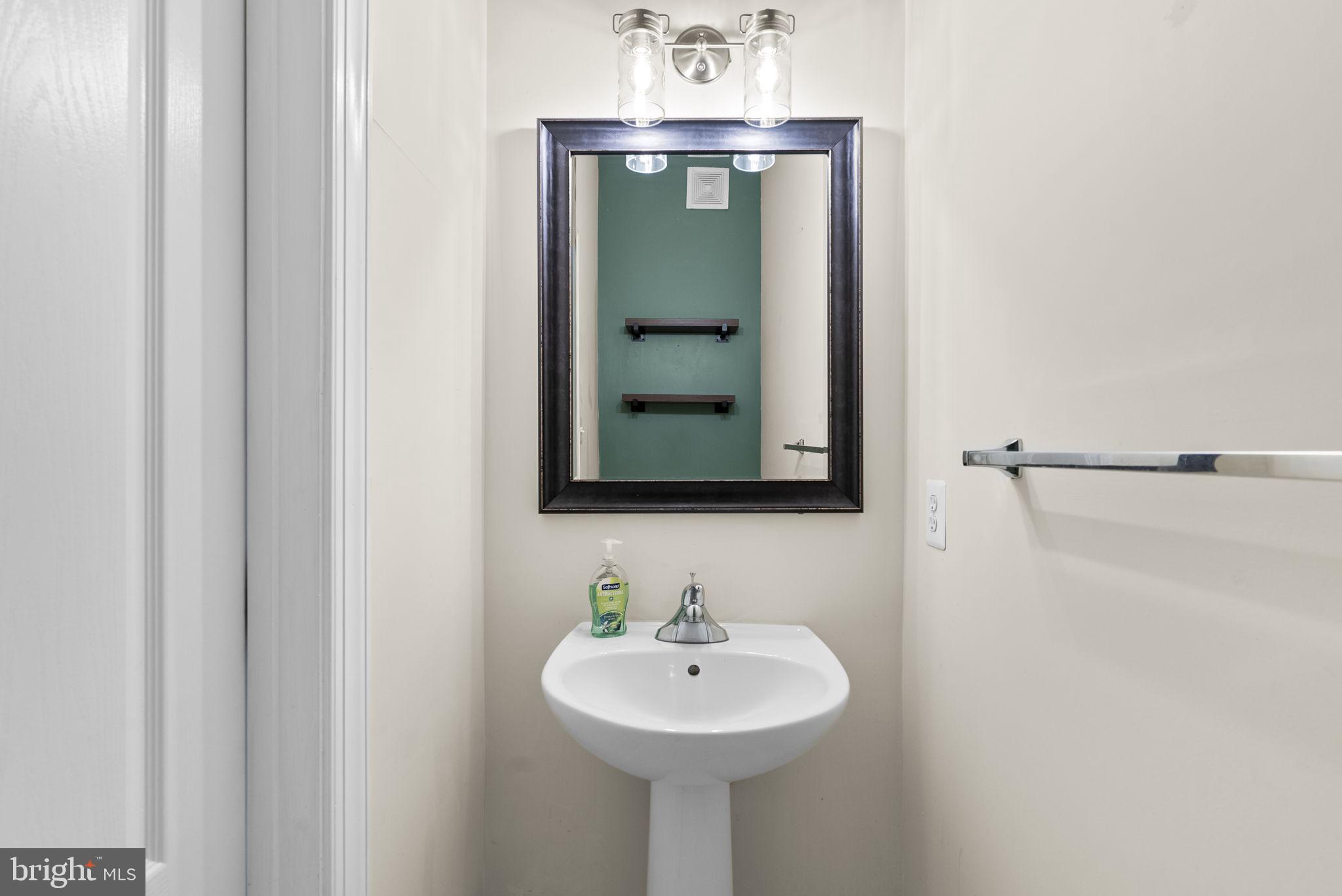 932 Orchard Ridge Drive, Unit 200 Gaithersburg, MD 20878 - Photo 28 of 51 a bathroom with a sink and a mirror