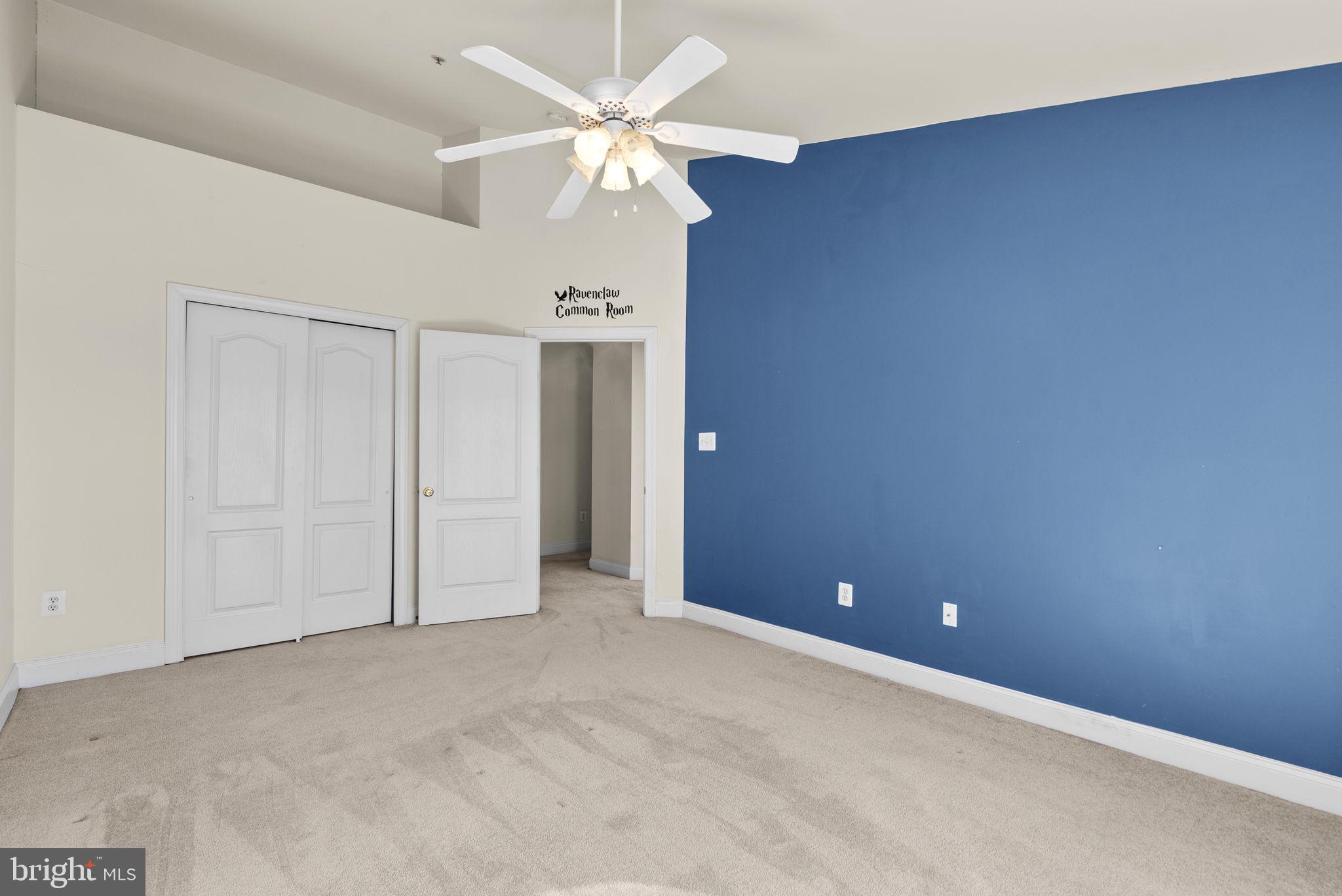 932 Orchard Ridge Drive, Unit 200 Gaithersburg, MD 20878 - Photo 40 of 51 an empty room with a ceiling fan and a window