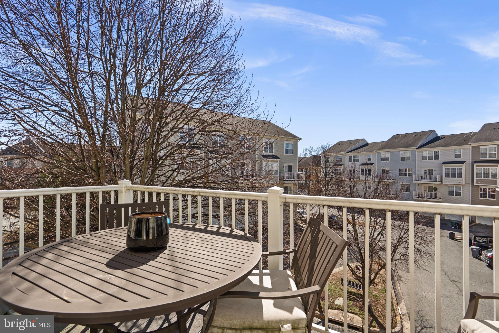 932 Orchard Ridge Drive, Unit 200 Gaithersburg, MD 20878 - Photo 43 of 51 a view of balcony with wooden floor and seating
