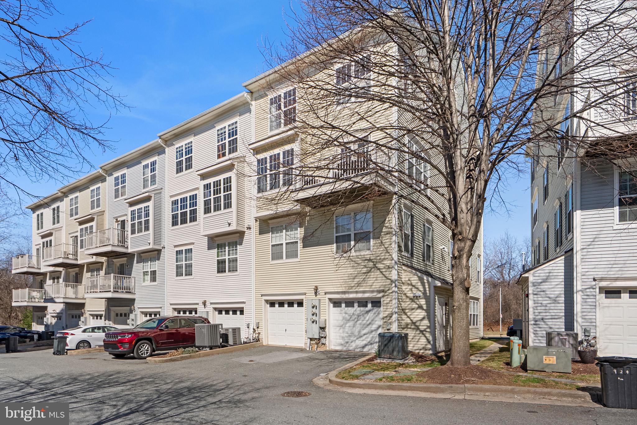 932 Orchard Ridge Drive, Unit 200 Gaithersburg, MD 20878 - Photo 45 of 51 a buildings with car parked in front of it