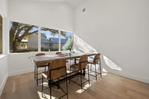 a living room with stainless steel appliances kitchen island granite countertop furniture and a kitchen view