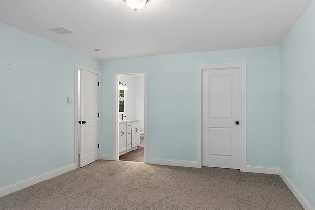 an empty room with closet area