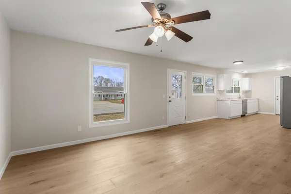 a view of an empty room with a window