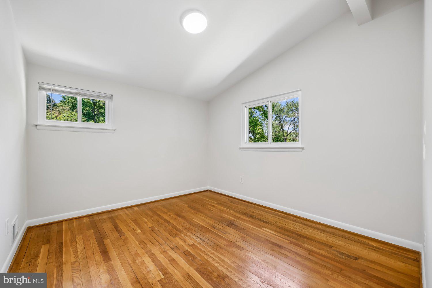 300 Gilsan Court Silver Spring, MD 20902 - Photo 77 of 117 a view of empty room with wooden floor and fan