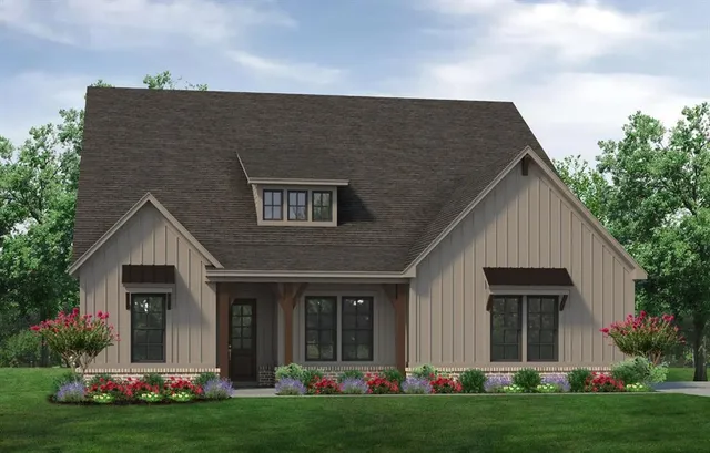 a front view of house with yard and green space