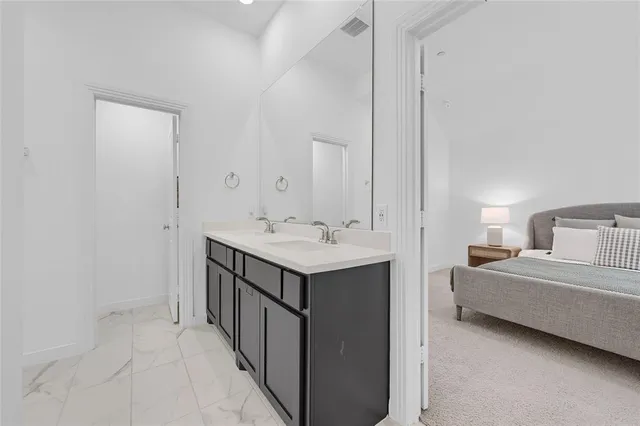 a bedroom with a bed and dresser