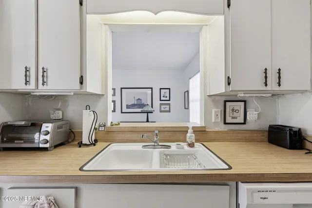 a view of a livingroom with furniture and window