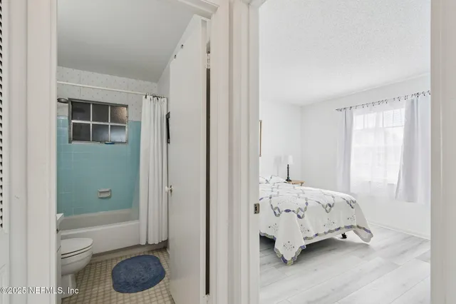 a en suite bathroom with a sink double vanity and a mirror