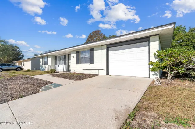 a view of a livingroom with furniture and wooden floor