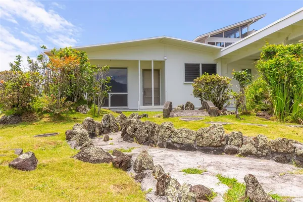 a view of house with swimming pool outdoor seating