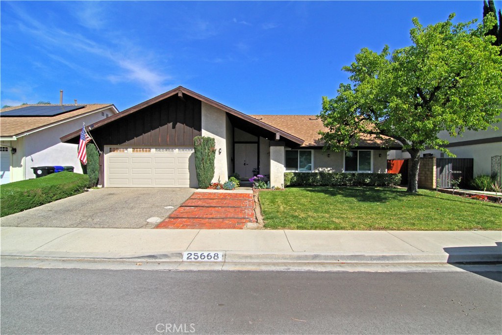 25668 Fedala Road Valencia, CA 91355 - Photo 1 of 1 a front view of a house with a yard
