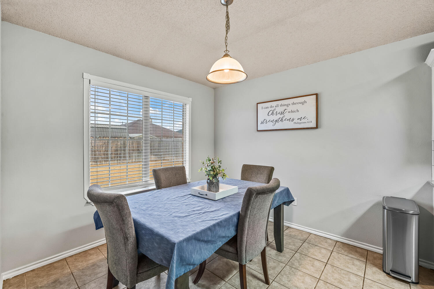 10607 Dover Avenue Lubbock, TX 79424 - Photo 17 of 34 a view of a dining room with furniture window and outside view
