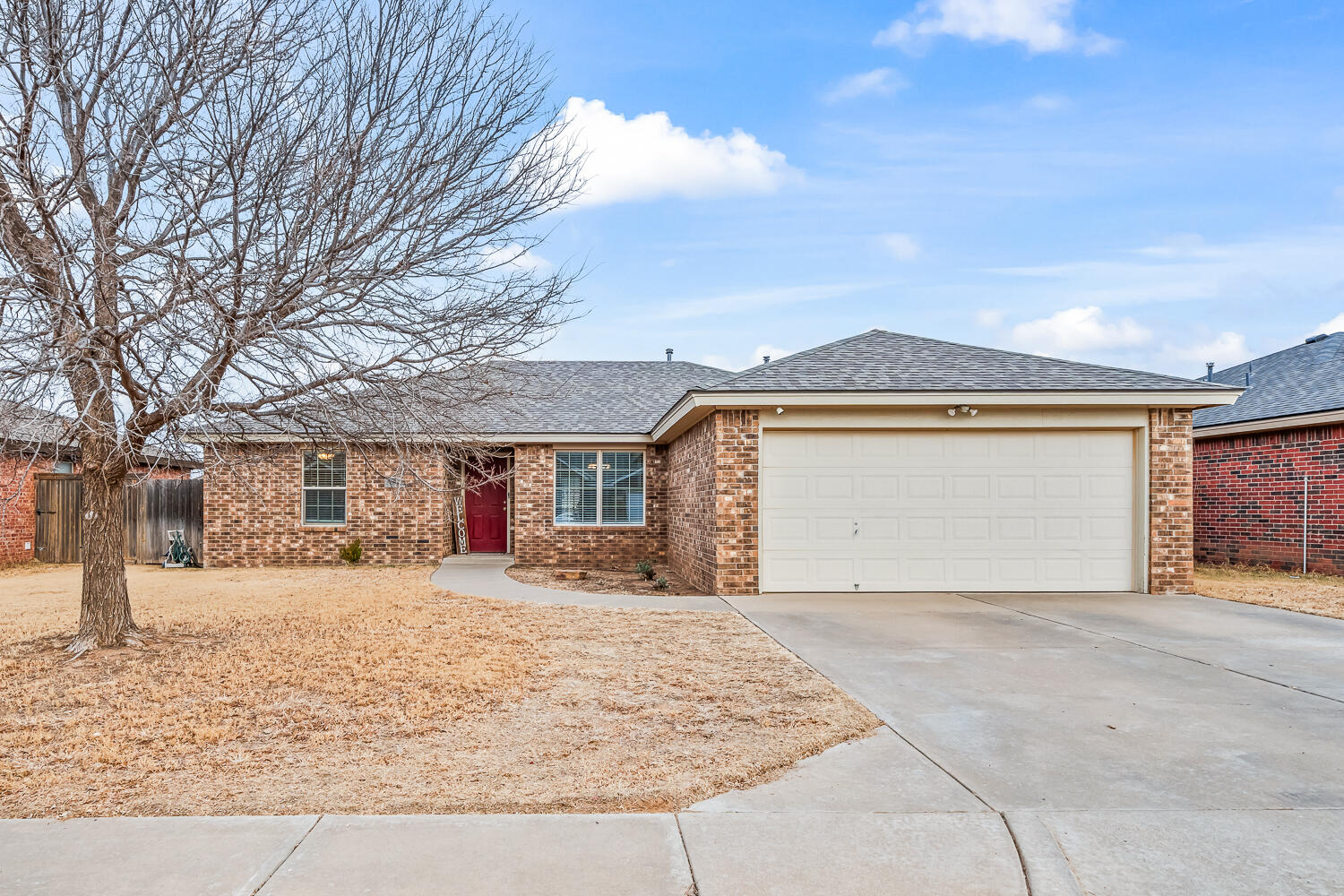 10607 Dover Avenue Lubbock, TX 79424 - Photo 2 of 34 front view of a house with a outdoor space