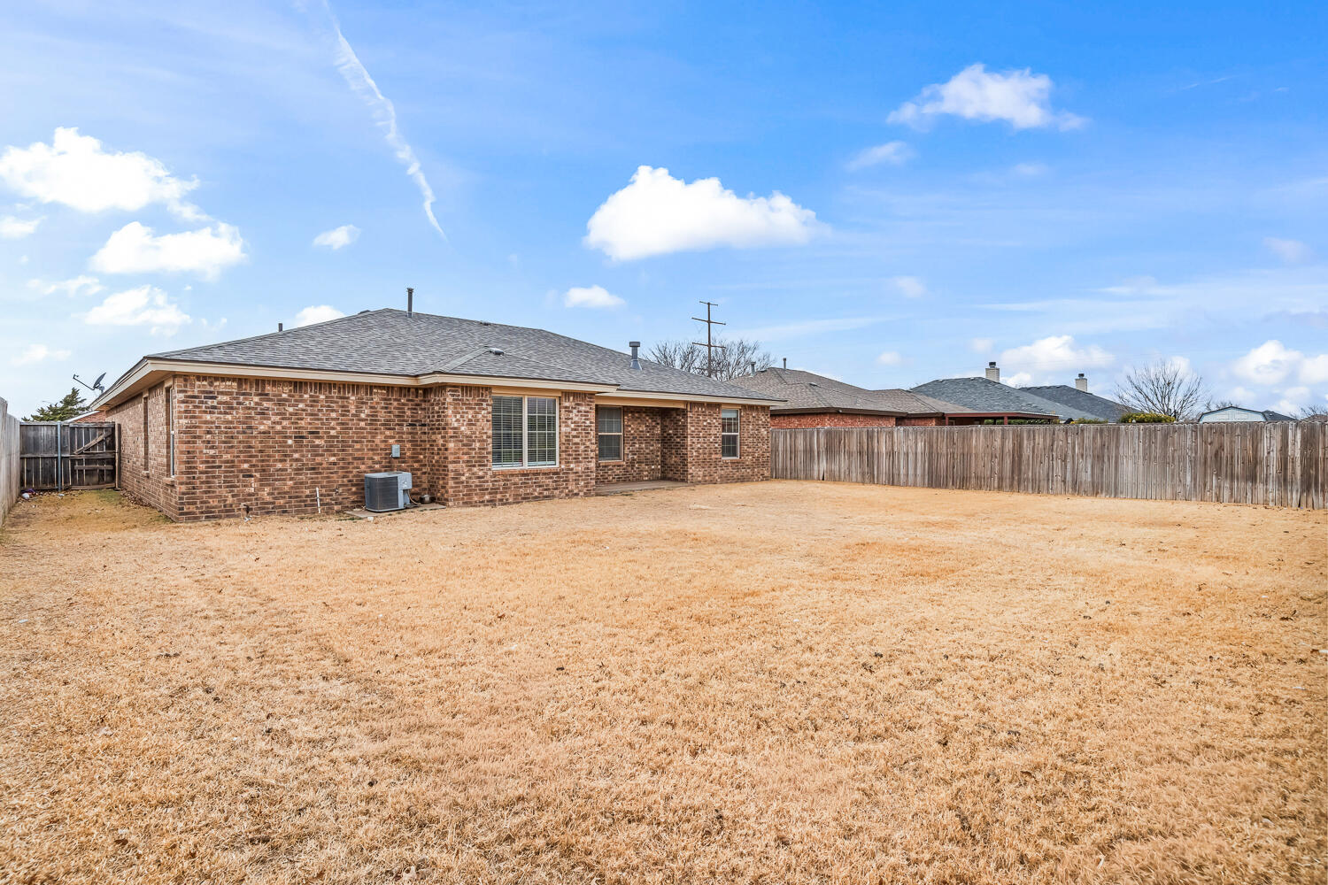10607 Dover Avenue Lubbock, TX 79424 - Photo 32 of 34 a front view of a house with a yard