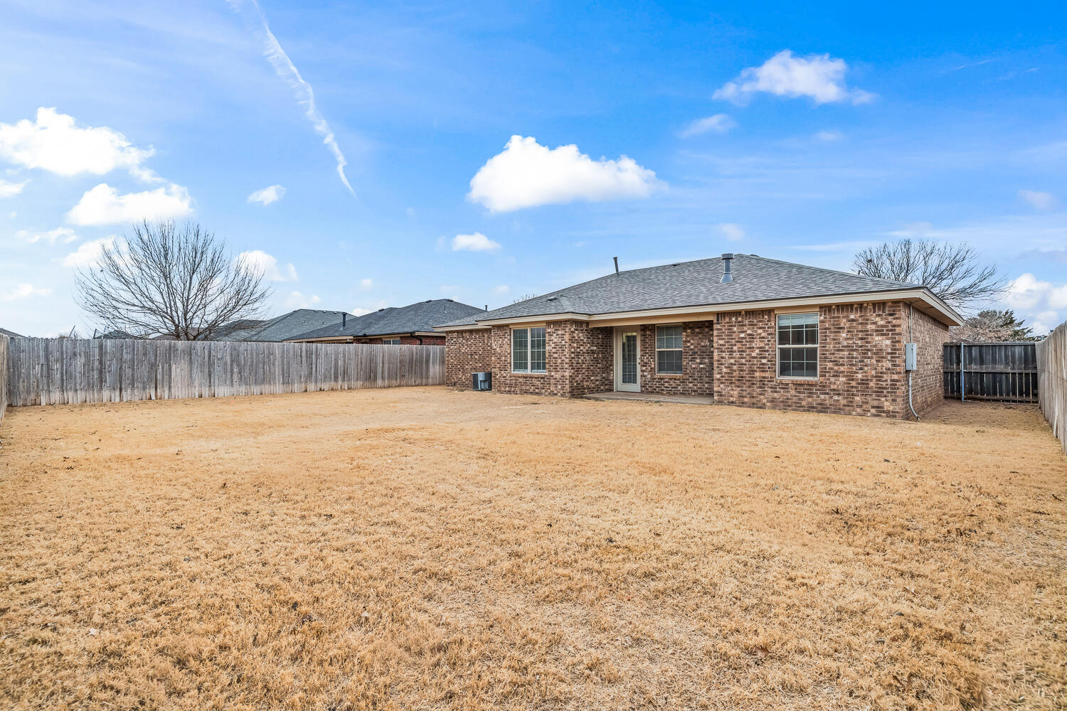 10607 Dover Avenue Lubbock, TX 79424 - Photo 34 of 34 a front view of a house with a yard