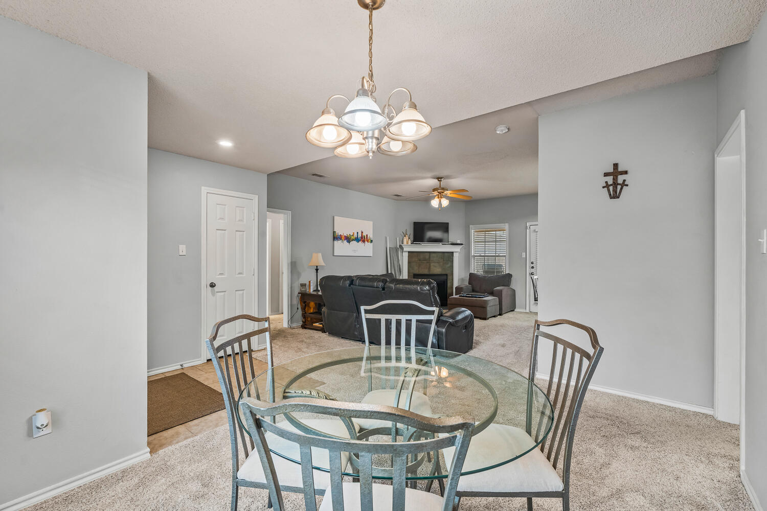 10607 Dover Avenue Lubbock, TX 79424 - Photo 9 of 34 a view of a dining room with furniture and chandelier
