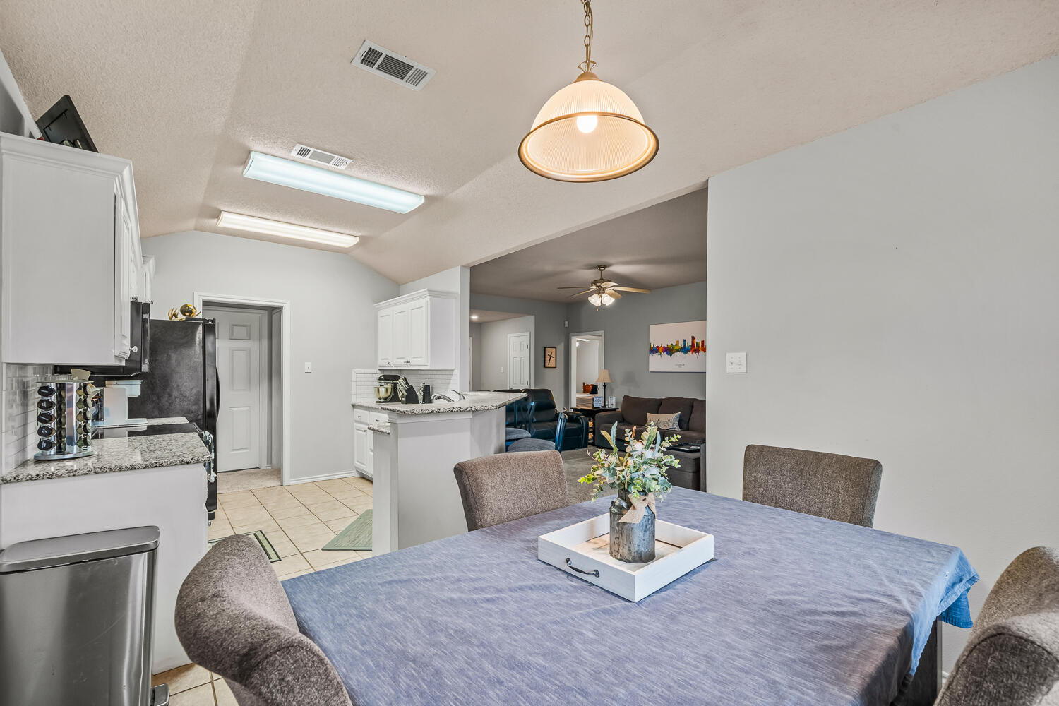 10607 Dover Avenue Lubbock, TX 79424 - Photo 10 of 34 a view of a dining room with furniture