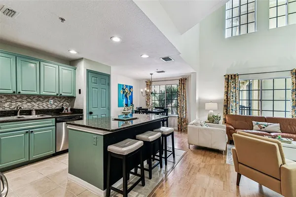 a kitchen that has a sink and a stove