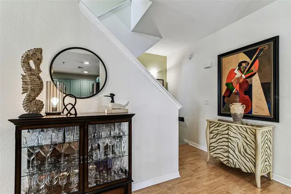 a living room with furniture a fireplace and a floor to ceiling window