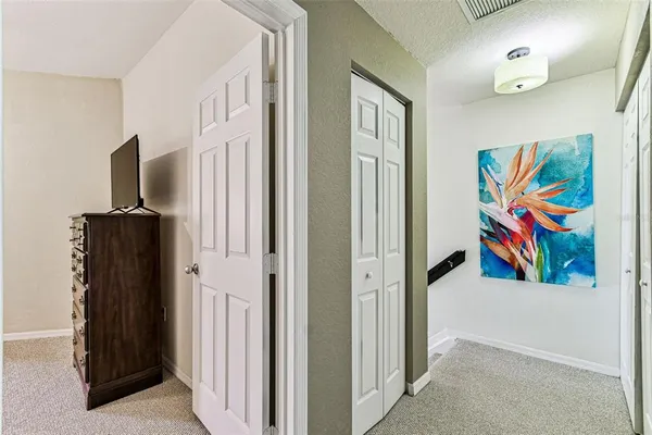 a kitchen with stainless steel appliances granite countertop a stove refrigerator and a view of living room
