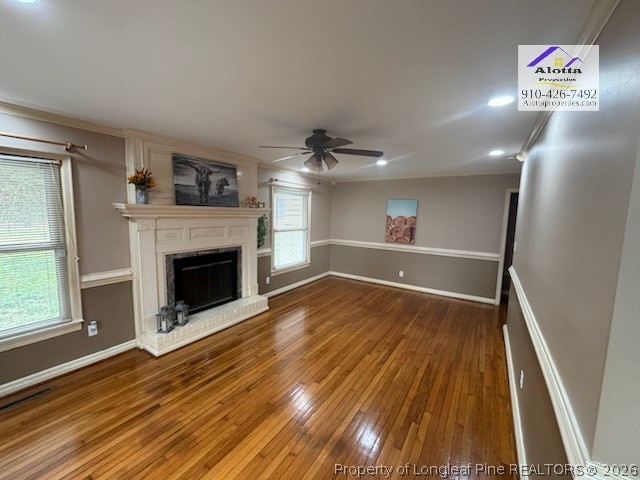 1817 McGougan Road Fayetteville, NC 28303 - Photo 16 of 24 a view of empty room with wooden floor and fireplace