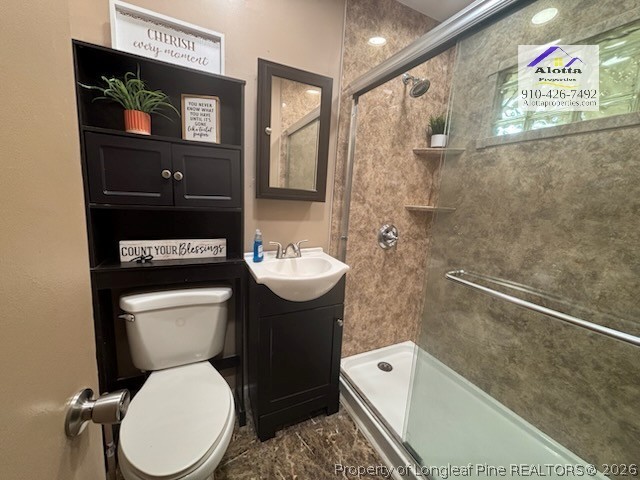 1817 McGougan Road Fayetteville, NC 28303 - Photo 17 of 24 a bathroom with a toilet sink and mirror
