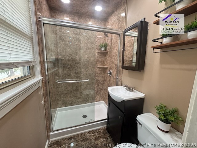 1817 McGougan Road Fayetteville, NC 28303 - Photo 19 of 24 a bathroom with a sink mirror toilet and shower