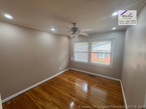 1817 McGougan Road Fayetteville, NC 28303 - Photo 20 of 24 an empty room with windows and fan