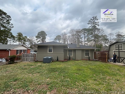 1817 McGougan Road Fayetteville, NC 28303 - Photo 7 of 24 a view of a house with a yard and large trees