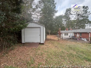 1817 McGougan Road Fayetteville, NC 28303 - Photo 8 of 24 a front view of a house with a yard and garage