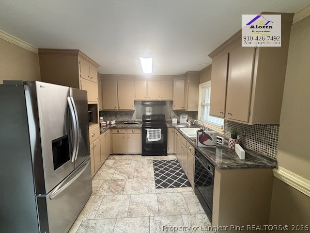 1817 McGougan Road Fayetteville, NC 28303 - Photo 10 of 24 a kitchen with granite countertop stainless steel appliances a refrigerator a sink a stove top oven and cabinets