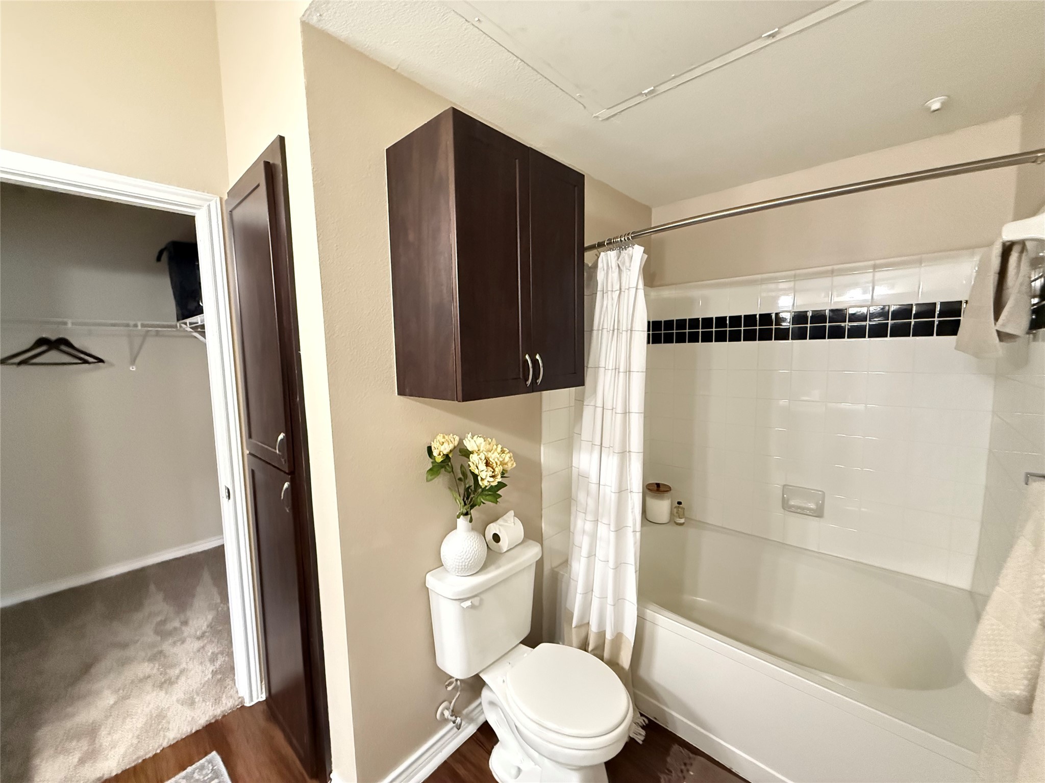 6607 Brodie Lane, Unit 535 Austin, TX 78745 - Photo 7 of 12 a bathroom with a shower and a toilet