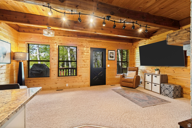 11237 East Aspen Road, Unit 74 Heber City, UT 84032 - Photo 5 of 32 Wood-paneled interior with exposed wood beams and track lighting