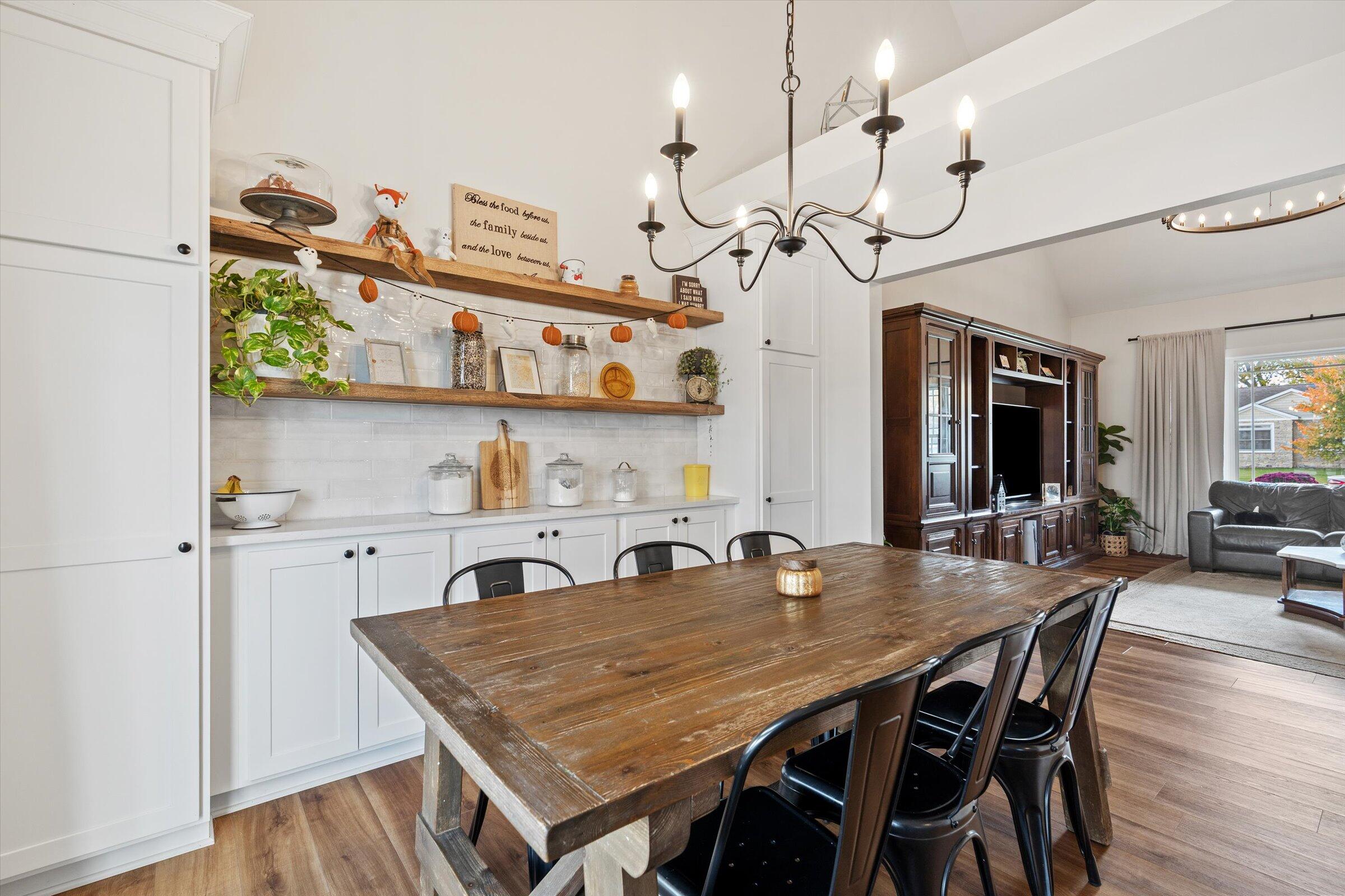 408 Coyote Trail Kouts, IN 46347 - Photo 13 of 36 a view of a dining room with furniture and wooden floor